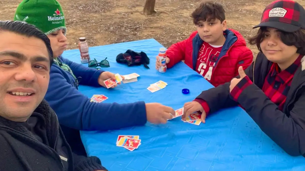 Garo Kotchounian and family playing Uno Flip