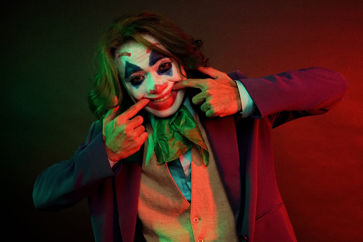 colorful scene of a person facepainted in many colors like joker