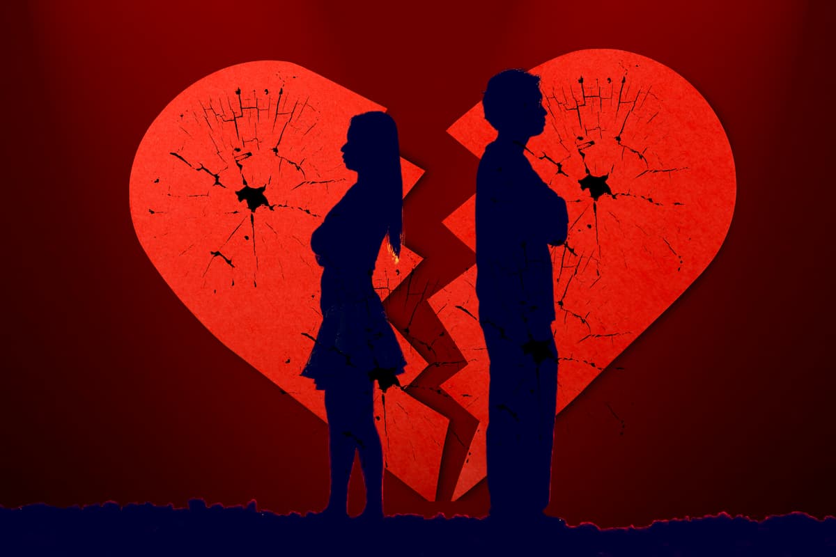 introverted couple looking opposite sides of each other, broken heart background.